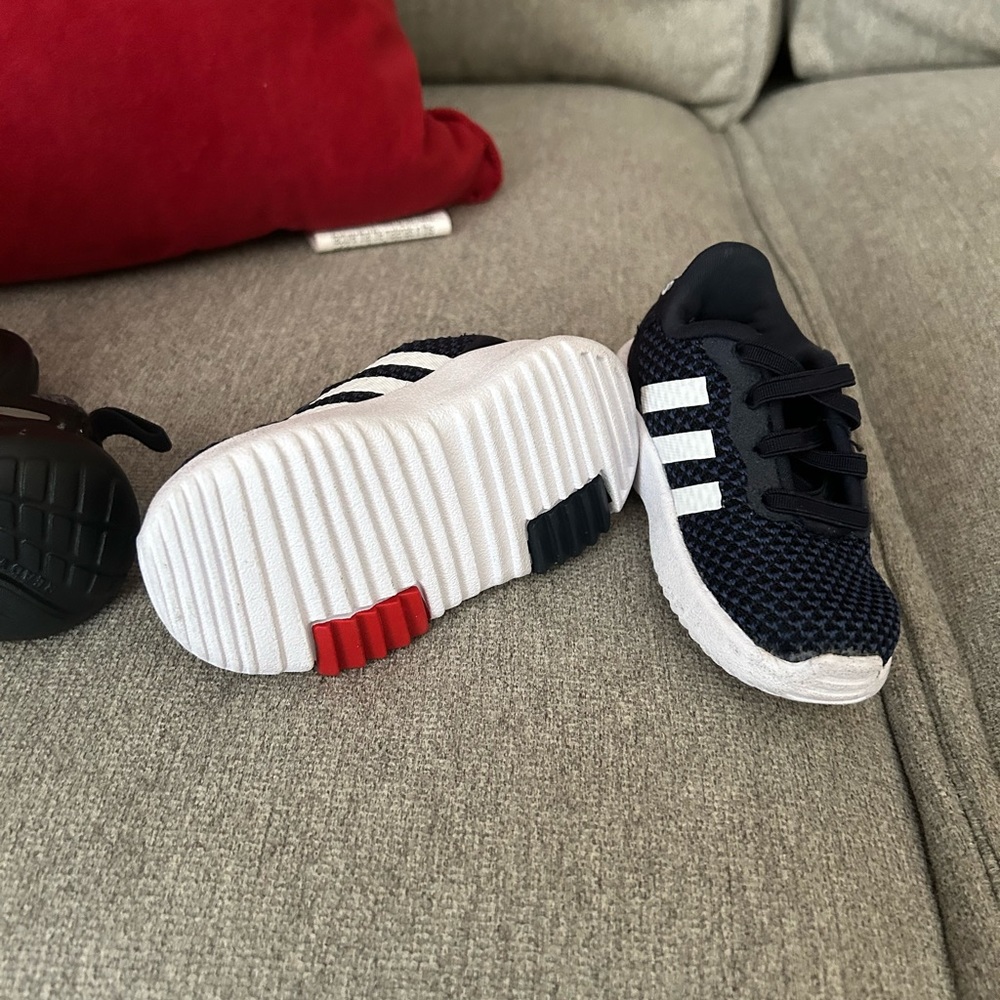 1 pair of black Nike sneakers, 1 pair of navy blue & white baby Adidas.